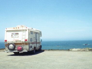 Caravan parked at a lookout with an ocean view.