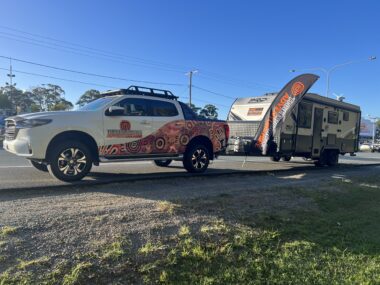 A beginner towing a caravan, checking the car’s towing capacity and preparing for a road trip.